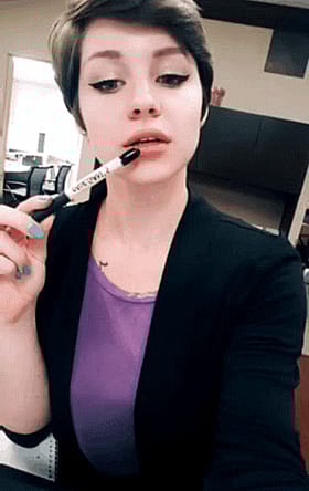 Brunette Cutie with Short Hair Sticking Out Her Tongue'