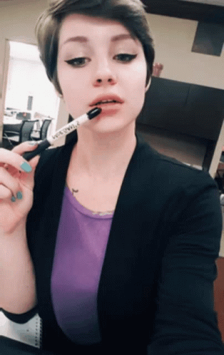 Brunette Cutie with Short Hair Sticking Out Her Tongue picture 1 of 1
