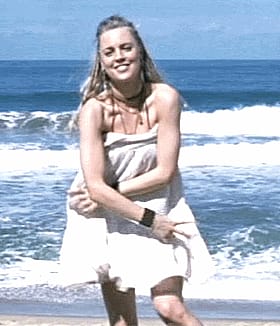 Hot Celebrity Babe Poses on the Beach in a White Dress'