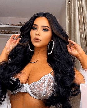 Sexy Non-Nude Black Chick with Big Tits and Long Hair'
