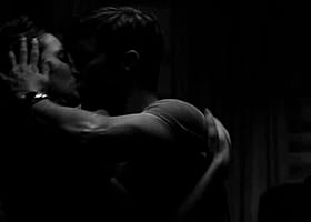 Get Your Kink On: Two People Kissing in the Dark'