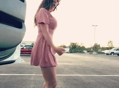 Hot Chick in Pink Dress Stands in Parking Lot picture 1 of 1