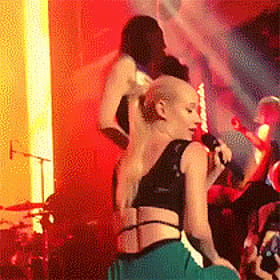 Iggy Azalea Bending Over in a Tight Green Skirt'