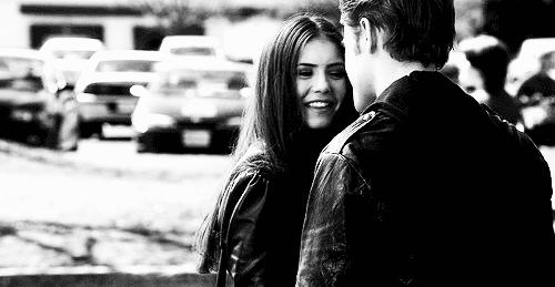 Sexy Girl Smiling at Boy in Black Jacket picture 1 of 1