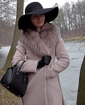 Amateur Lingerie Model Poses in Black Hat and Pink Coat'