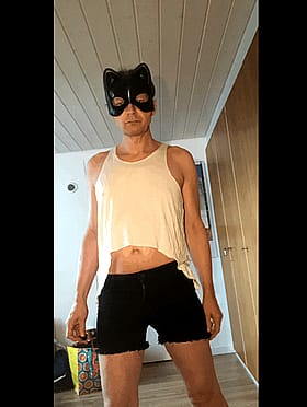 Wearing Lingerie and Black Shorts'