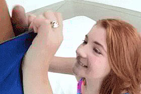 Redhead Teen Gives Blowjob in College'
