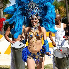 Brazilian Carnival Dancer in Blue Feathered Headdress'