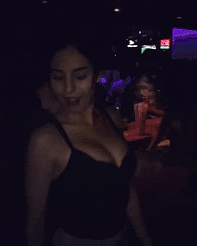Brunette Babe with Big Tits Shakes Her Booty in the Club'