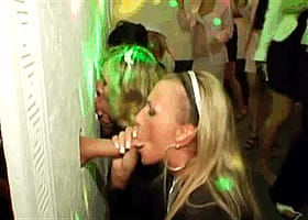 Blowjob in a gloryhole: Two hot chicks get it on in a public restroom'