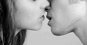 Kissing Face: Two People Locking Lips'