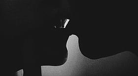 Lesbian Kissing GIF: Two Women Kissing in Black and White'