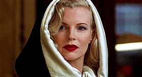 Blonde Celebrity's Sultry Look: Red Lips and White Robe'