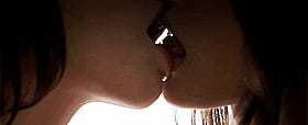 Lesbian Kiss: Two Girls Locking Lips'