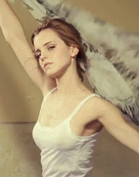 Busty Babe in White Tank Top Flaunts Her Wings'